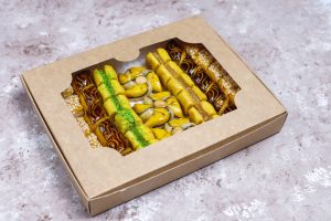 Traditional oriental sweets with different nuts on concrete  bac