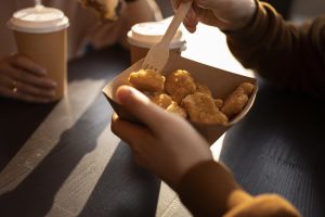 best-friends-eating-street-food_23-2149009617