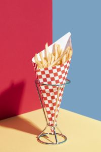 food-arrangement-with-fries-stand_23-2148314174