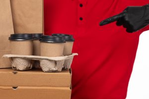 front-view-female-courier-red-shirt-black-gloves-holding-boxes-coffee-cups_140725-19154